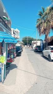 a street with cars parked on the side of the road at Billis Cologne Apartment in Flogita
