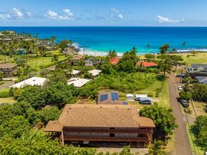 an aerial view of a resort with the ocean at Hale Kahana'lu in Koloa