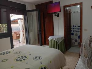 Posteľ alebo postele v izbe v ubytovaní JARDIN, TERRAZA Y BARBACOA