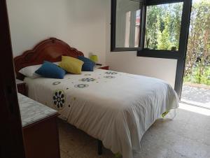 Posteľ alebo postele v izbe v ubytovaní JARDIN, TERRAZA Y BARBACOA