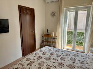 Postel nebo postele na pokoji v ubytování Valentina's Verona