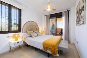 a bedroom with a bed and a large window at Apartment with Private Terrace Calanova Golf by AORA STAY in Mijas Costa +32 photos