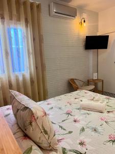 Postel nebo postele na pokoji v ubytování Hostal El Faro