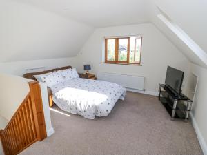 En eller flere senge i et værelse på Little Barn