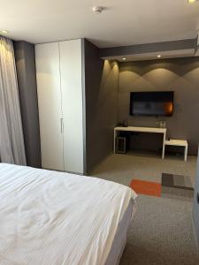 TV a/nebo společenská místnost v ubytování Boutique Hotel Kanyon