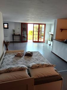 a bedroom with a large bed with two towels on it at Pian delle Betulle in Torri del Benaco