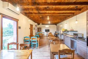 a dining room with wooden tables and chairs at Hotel Los Rastrojos in Sinovas