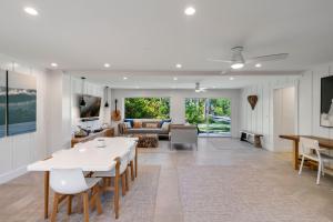 a living room with a table and a couch at Camp Magic 2 in Hanalei