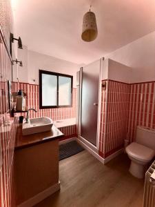 a bathroom with a sink and a toilet at Chalet en Alfacar Sierra de Huétor in Alfacar