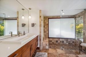 a bathroom with a large sink and a shower at Kapiolani - As seen on HGTV in Princeville +58 photos