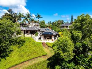 an aerial view of a house with trees at Kapiolani - As seen on HGTV in Princeville