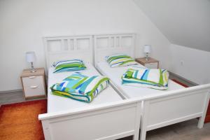 Postel nebo postele na pokoji v ubytování Föveny Apartmanok