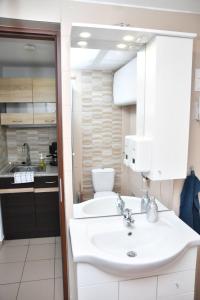 Kuchyň nebo kuchyňský kout v ubytování Föveny Apartmanok + 37 fotografií