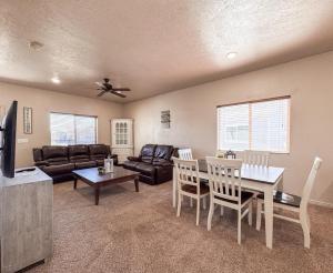 a living room with a couch and a table at Bear Lake Escape-Pet Friendly in Garden City