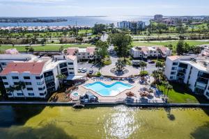 an aerial view of a resort with a swimming pool at Charming 2-Bedroom, 2-Bath Condo with Golf Course Views in Isla Del Sol in Point Brittany