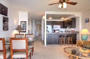 a living room with a dining room and a kitchen at Maalaea Kai 316 in Kihei