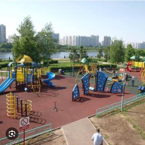 a park with a playground with slides and rides at Ботаника , парк долина роз аеропорт in Chişinău