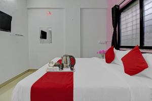 Postel nebo postele na pokoji v ubytování Hotel O Happy Stay + 29 fotografií