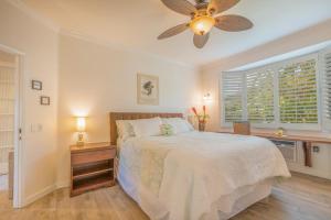 a bedroom with a bed and a ceiling fan at Hale Emmalani #311 in Princeville