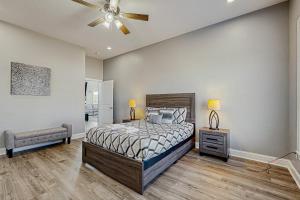 a bedroom with a bed and a ceiling fan at Sunset Valley in Kirk O'Cliff