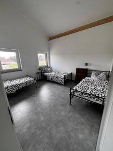 Postel nebo postele na pokoji v ubytování Bade Homes