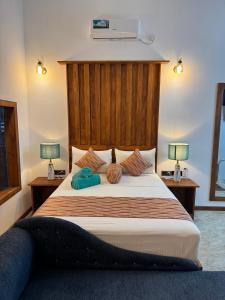 Postel nebo postele na pokoji v ubytování Palmyra Nature Resort Sigiriya
