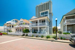 a row of houses on a brick street with buildings at Sunrise Playce-Designer Beach Retreat + Pool Table in Atlantic City