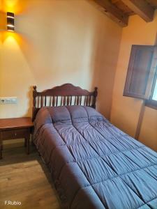 a bedroom with a bed and a table at Boro-Vía Láctea in Borobia +4 photos
