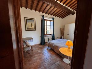 Postel nebo postele na pokoji v ubytování Agriturismo e Glamping Serraiola Alta