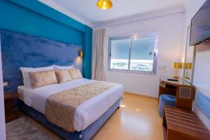 Postel nebo postele na pokoji v ubytování Moroccan Floors - Suites Appart-Hôtel