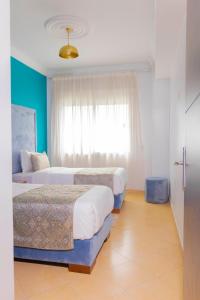 Postel nebo postele na pokoji v ubytování Moroccan Floors - Suites Appart-Hôtel