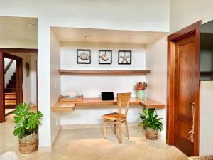 a home office with a desk with a laptop on it at Hale Aku in Hanalei +14 photos