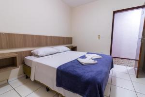 Postel nebo postele na pokoji v ubytování Foz Central Budget Hotel