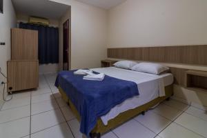Postel nebo postele na pokoji v ubytování Foz Central Budget Hotel + 16 fotografií