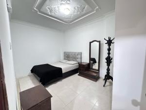 Postel nebo postele na pokoji v ubytování Guatapurí Apartamentos & Relax