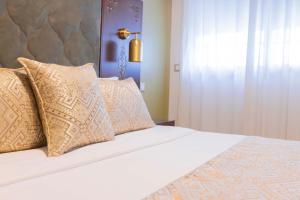 Postel nebo postele na pokoji v ubytování Moroccan Floors - Suites Appart-Hôtel