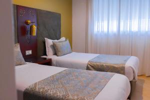 Postel nebo postele na pokoji v ubytování Moroccan Floors - Suites Appart-Hôtel