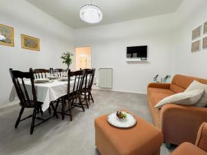 a living room with a table and a couch at Apartment Villa Elsa in Portorož