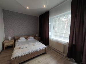 Postel nebo postele na pokoji v ubytování Pokoje Piaskowa 44