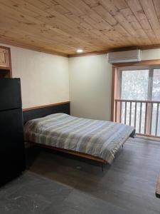Postel nebo postele na pokoji v ubytování Brookside Motor Inn