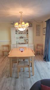 a dining room with a table and a kitchen at 210 Worchester St #405 in Ocean City