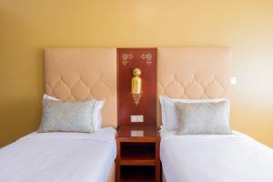 Postel nebo postele na pokoji v ubytování Moroccan Floors - Suites Appart-Hôtel