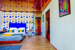 a bedroom with a king sized bed in a room at Kitumo Mara Lodges in Mara Simba +50 photos