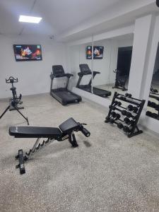a gym with several exercise bikes in a room at athensdot in Athens +88 photos