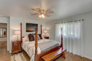 a bedroom with a bed and a ceiling fan at Fern Forest Hale in Volcano