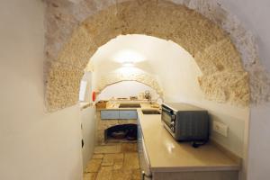 A kitchen or kitchenette at Masseria Macchia