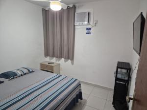 Postel nebo postele na pokoji v ubytování Sossai Hostel Flats