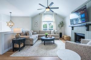a living room with a couch and a fireplace at New Remodel! 4BR Near DT Cartersville & Major Hwys in Cartersville
