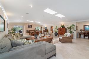 a large living room with couches and a table at Kailua Beachside in Kailua