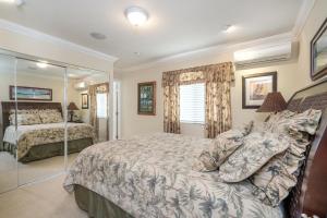 a bedroom with two beds and a mirror at Kailua Beachside in Kailua +31 photos